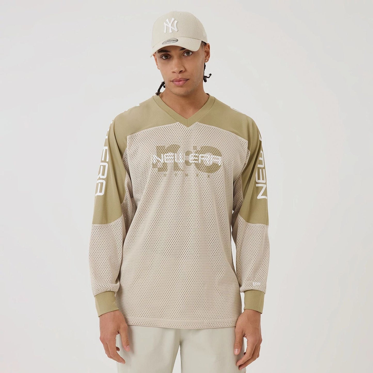 The model is wearing this New Era Urban Core Long Sleeve Jersey in beige/khaki. 1
