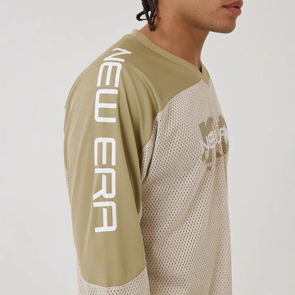 The model is wearing this New Era Urban Core Long Sleeve Jersey in beige/khaki. 4