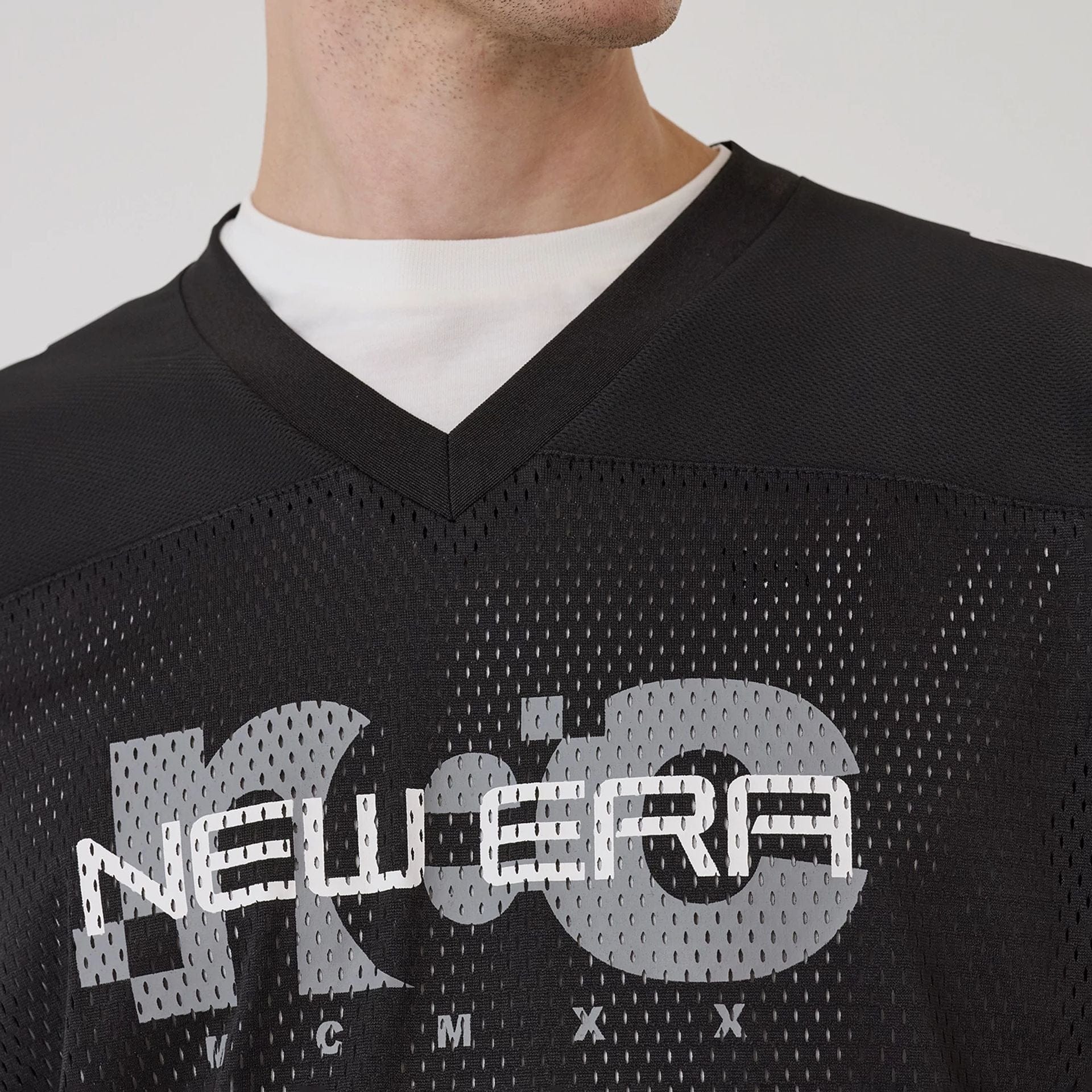 The model is wearing this New Era Urban Core Long Sleeve Jersey in black. 3
