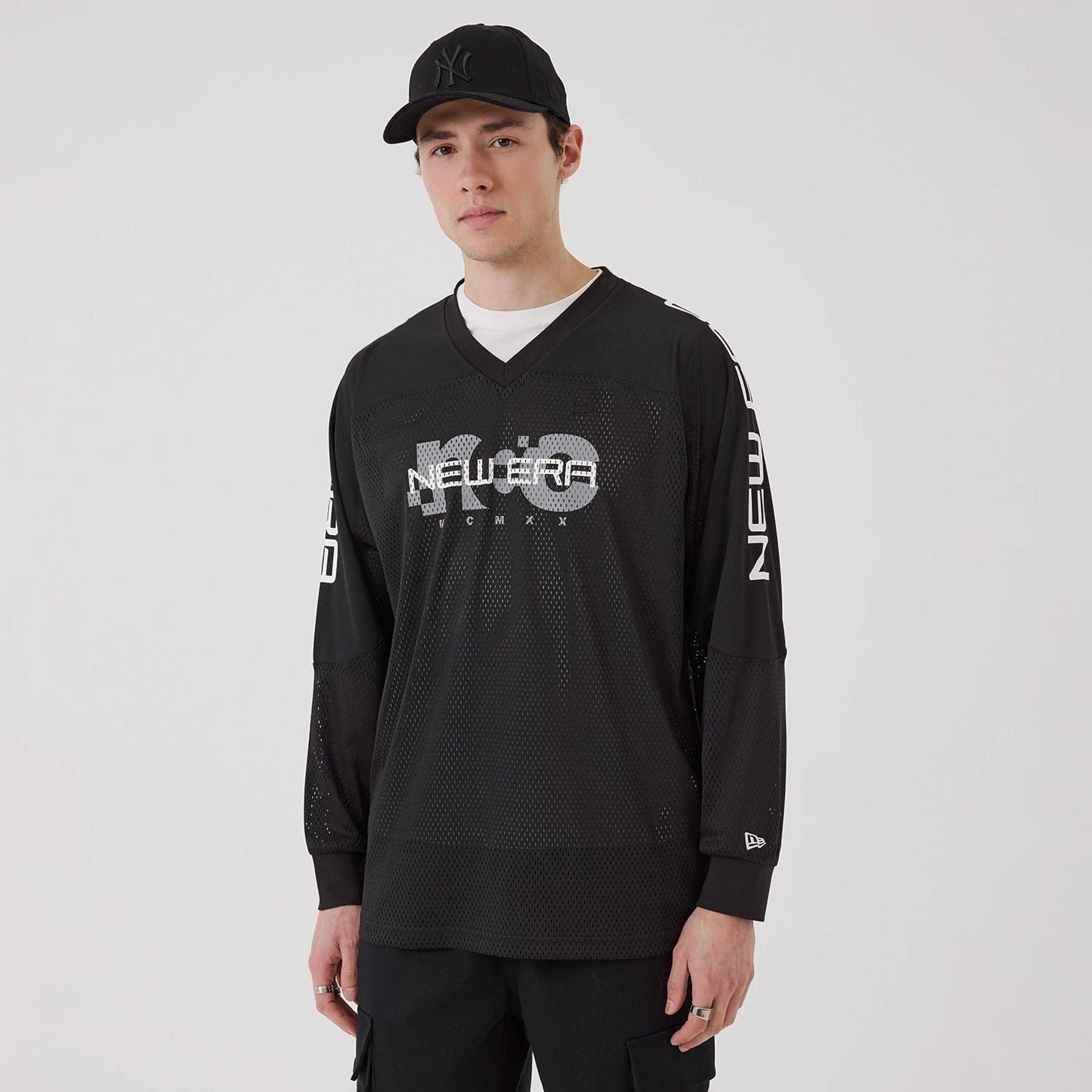 The model is wearing this New Era Urban Core Long Sleeve Jersey in black. 1
