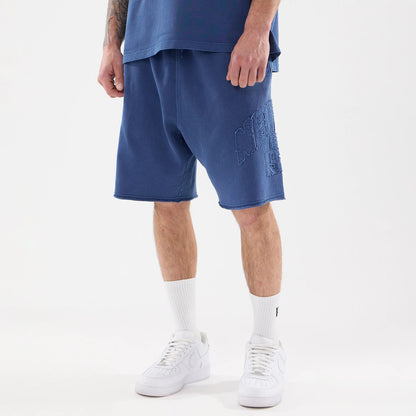 The model is wearing this New Era Street Archived Oversized Shorts in blue. 1
