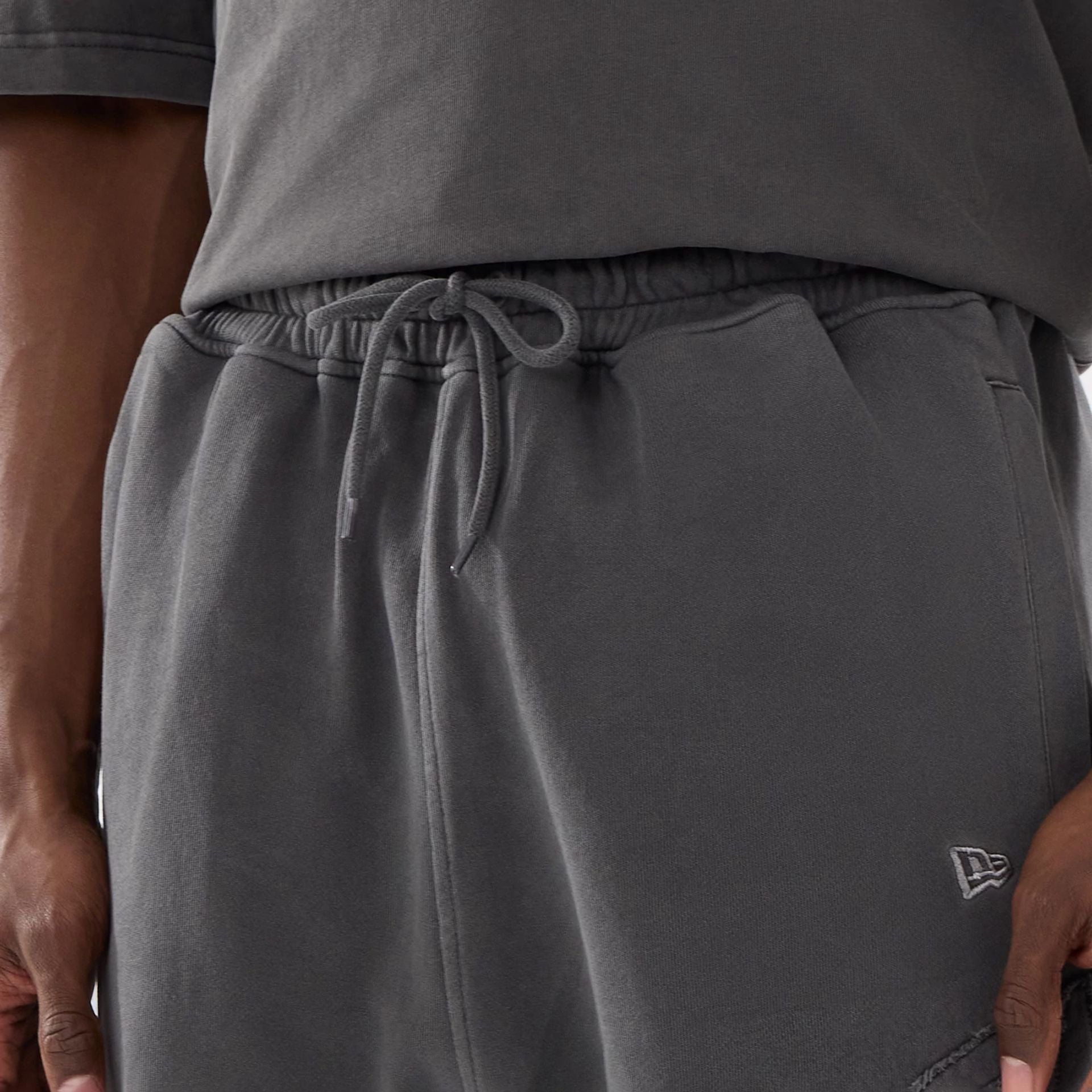 The model is wearing this New Era Street Archived Oversized Shorts in black. 6