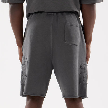 The model is wearing this New Era Street Archived Oversized Shorts in black. 7