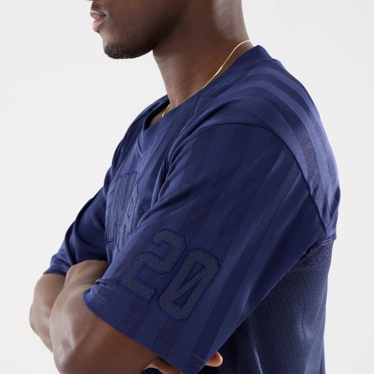 The model is wearing this New Era Street Archived Mesh Jersey in navy. 5