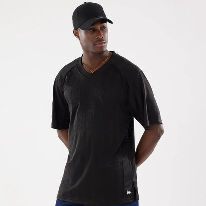 The model is wearing this New Era Street Archived Mesh Jersey in black. 1
