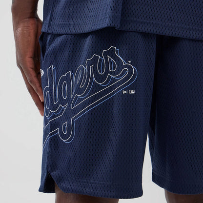 The model is wearing this MLB Mix League LA Dodgers Oversized Mesh Shorts in blue. 2