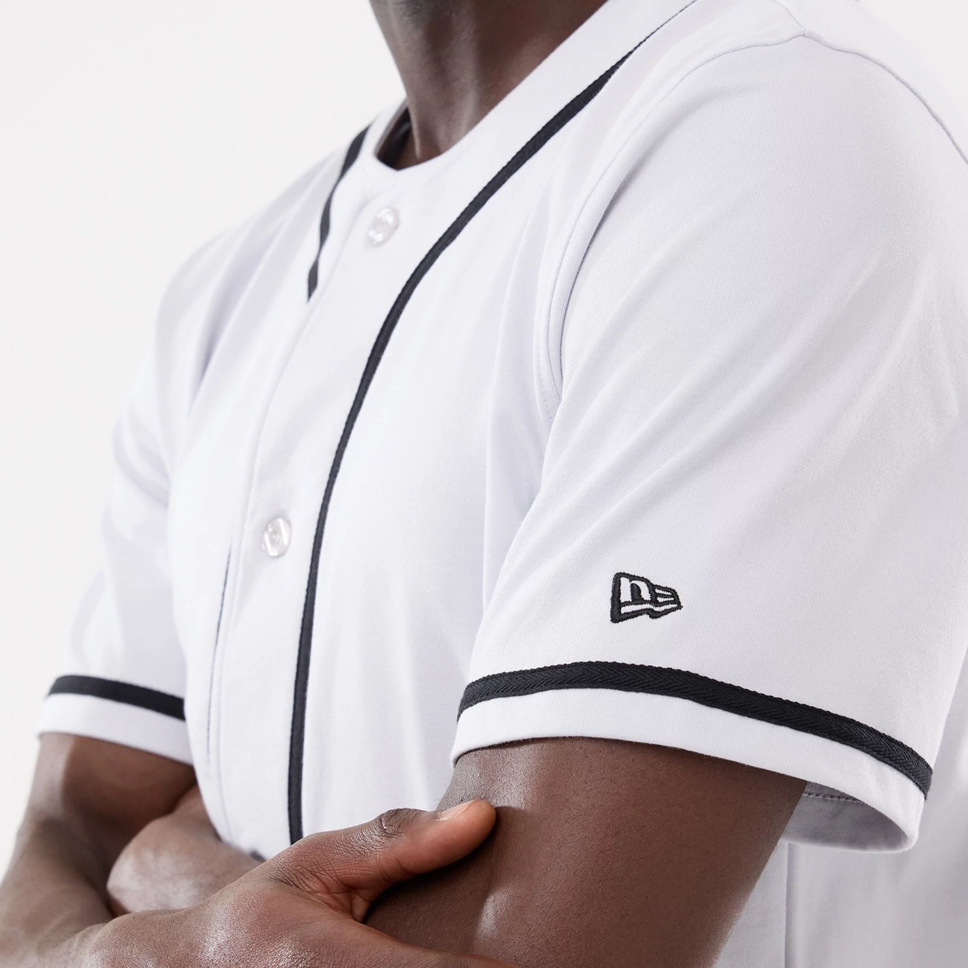 The model is wearing this New Era Basic Jersey in white. 4