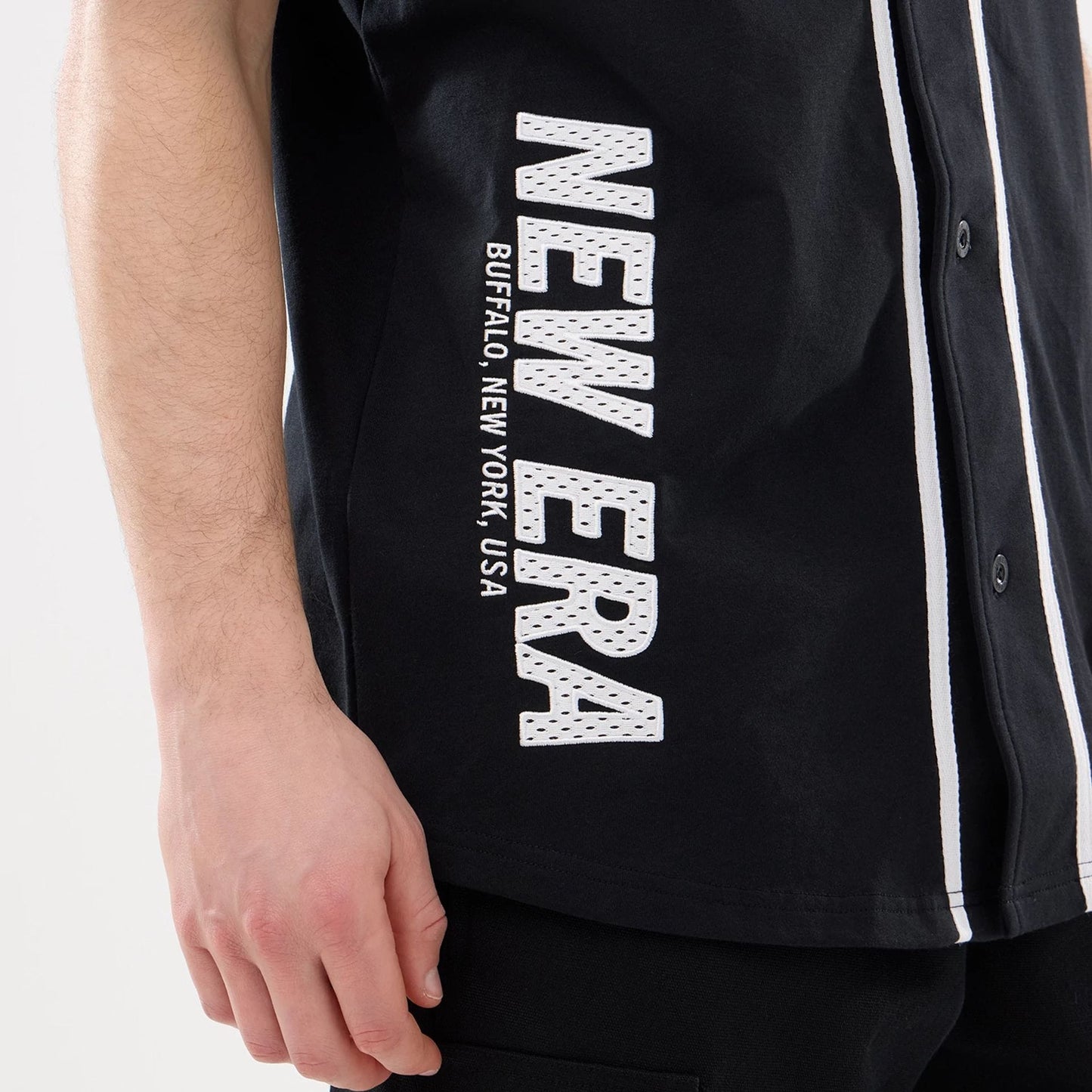 The model is wearing this New Era Basic Jersey in black. 3