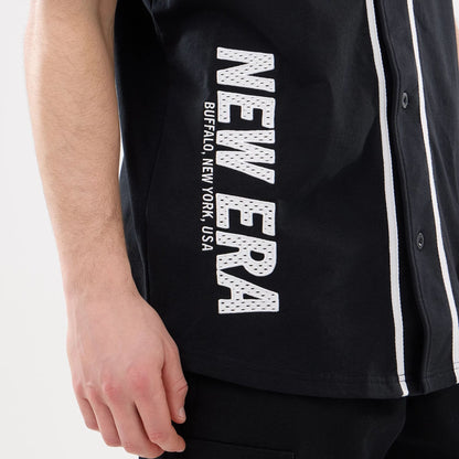 The model is wearing this New Era Basic Jersey in black. 3