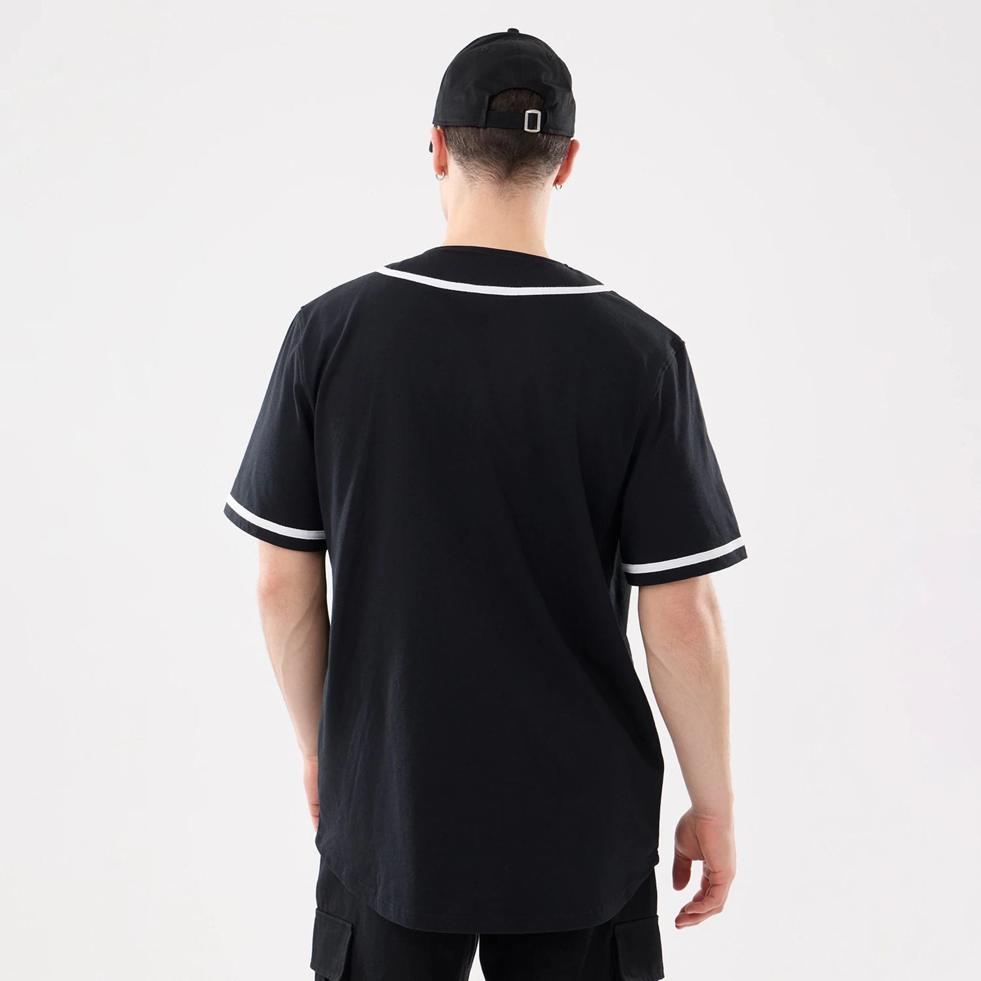 The model is wearing this New Era Basic Jersey in black. 2