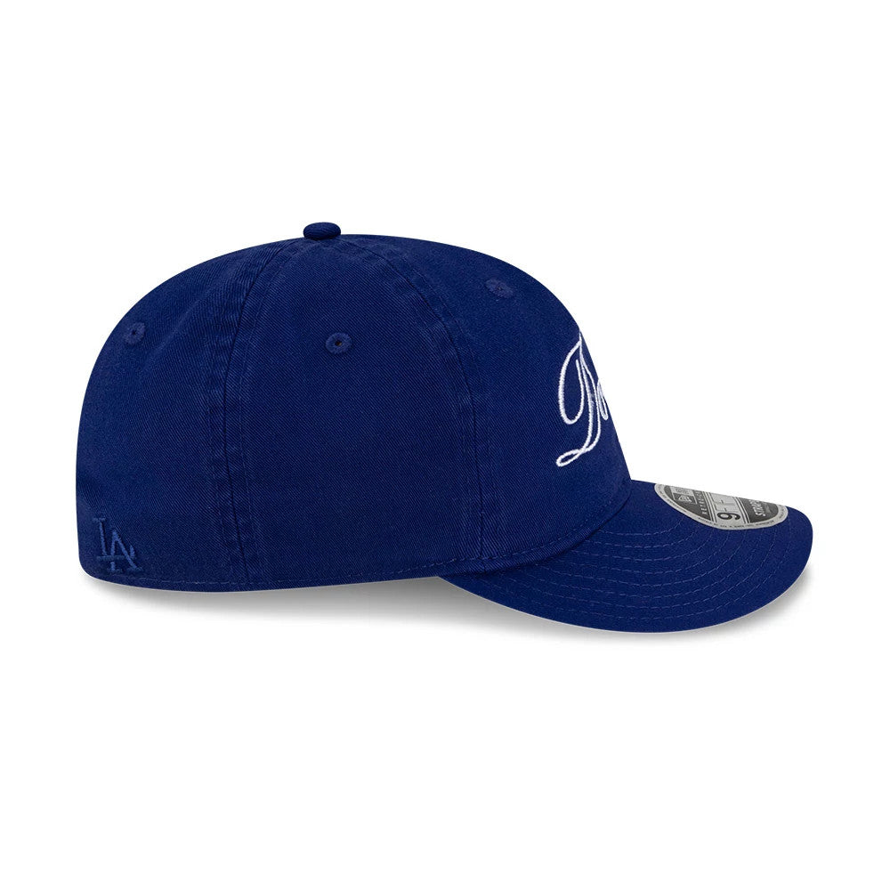 LA Dodgers Thisisneverthat X MLB Dark Blue Retro Crown New Era 9FIFTY Adjustable Cap, side view showing the raised embroidered LA logo on the side panel and the 9FIFTY size sticker on the dark blue curved visor.