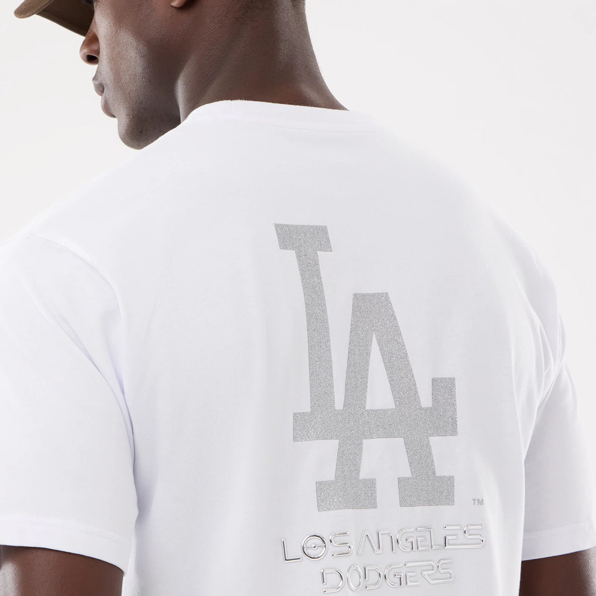 The model is wearing this Hajime Sorayama X MLB LA Dodgers T-Shirt in white. 5
