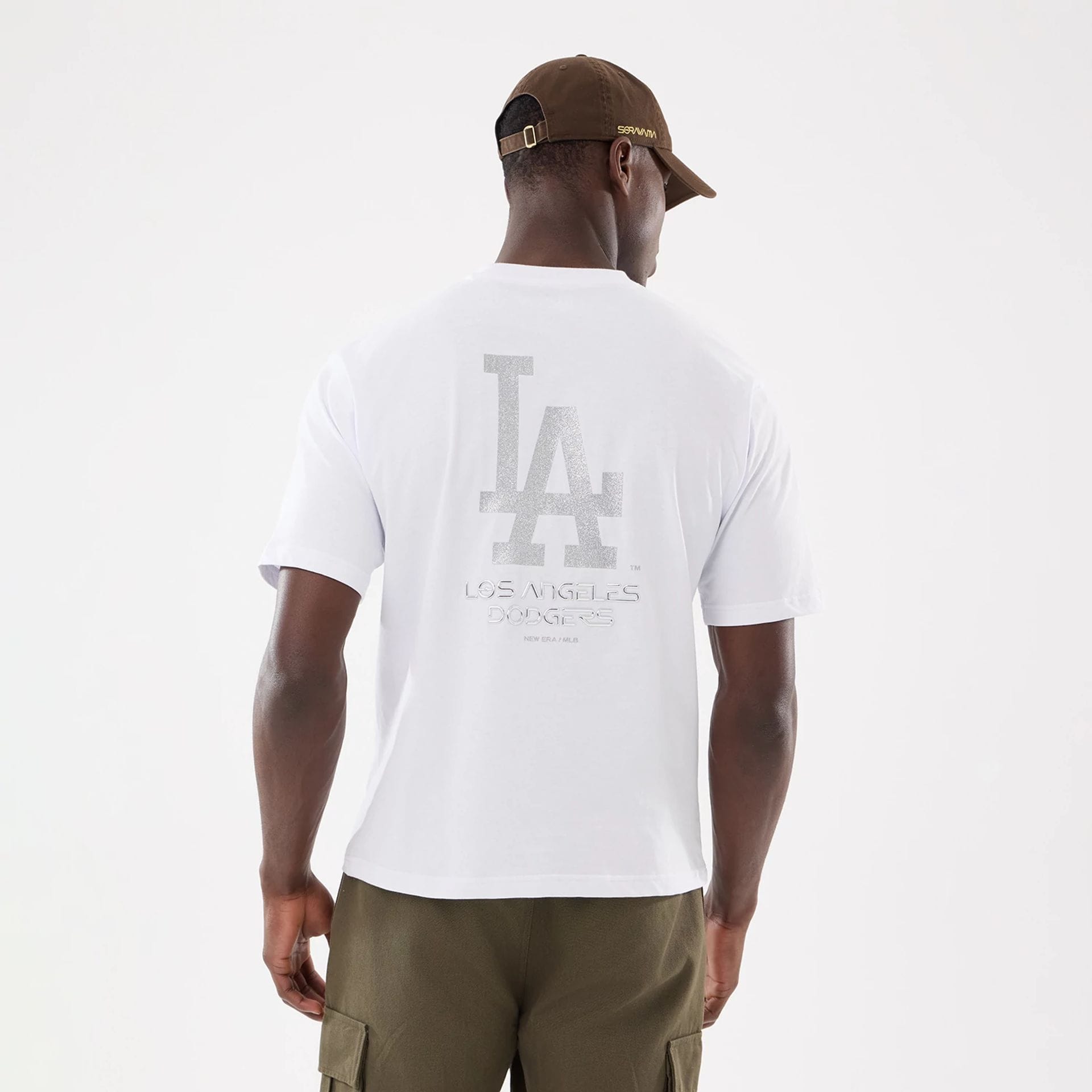 The model is wearing this Hajime Sorayama X MLB LA Dodgers T-Shirt in white. 2