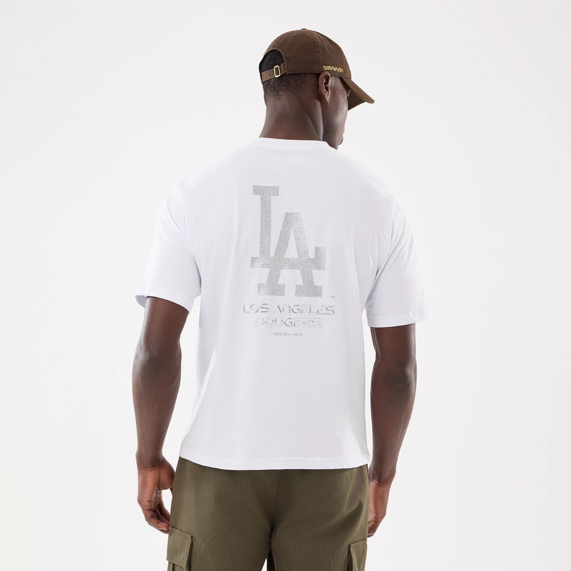 The model is wearing this Hajime Sorayama X MLB LA Dodgers T-Shirt in white. 2