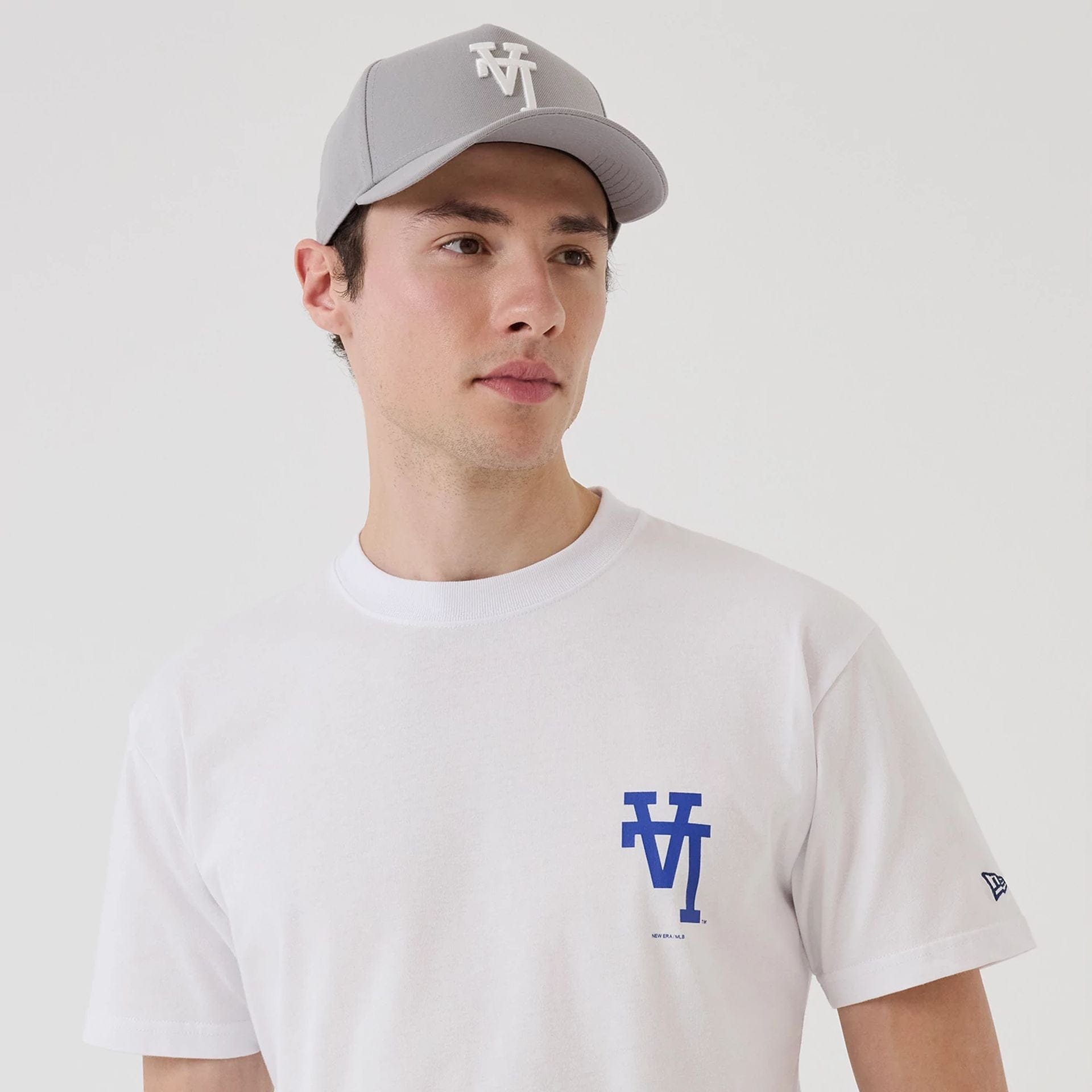 The model is wearing this MLB Upside Down LA Dodgers T-Shirt in white. 7