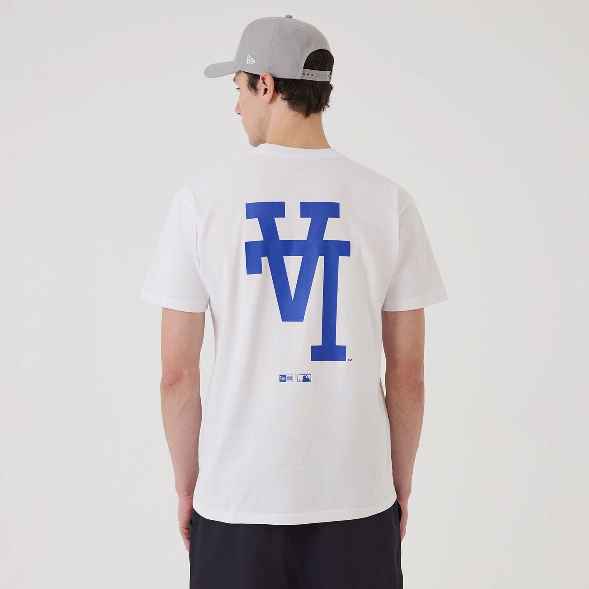 The model is wearing this MLB Upside Down LA Dodgers T-Shirt in white. 2