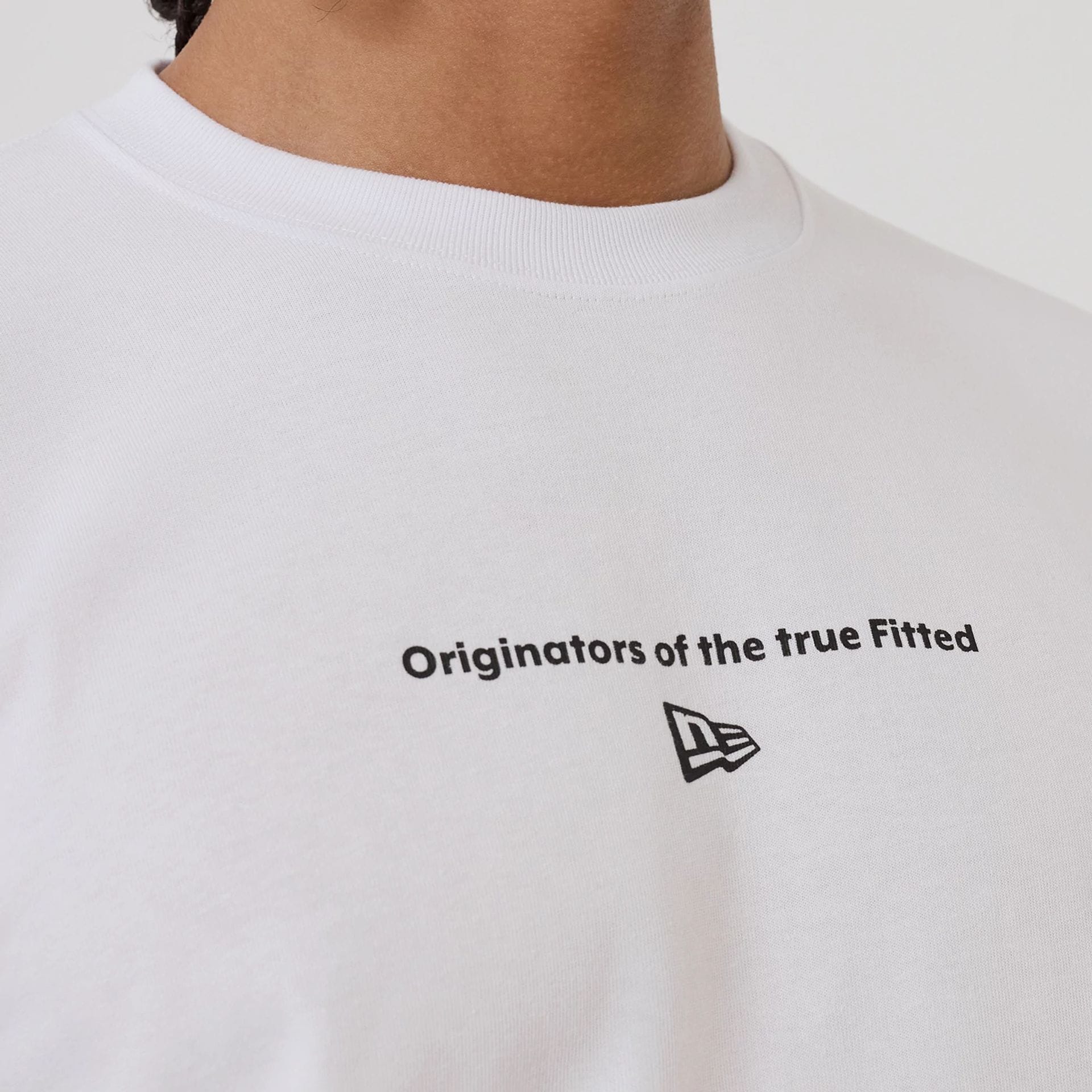 The model is wearing this New Era Circle T-Shirt in white. 3