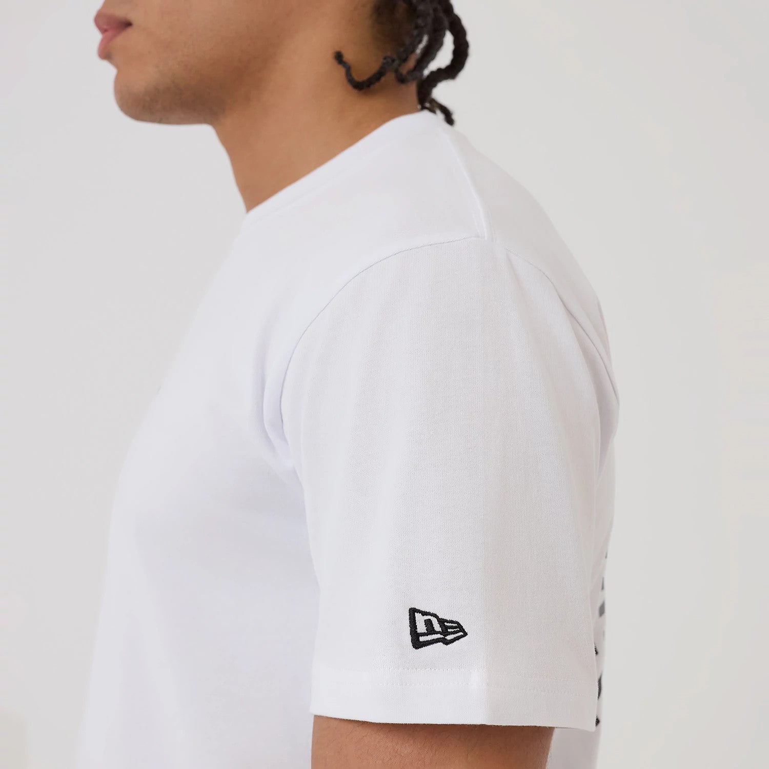 The model is wearing this New Era Circle T-Shirt in white. 7