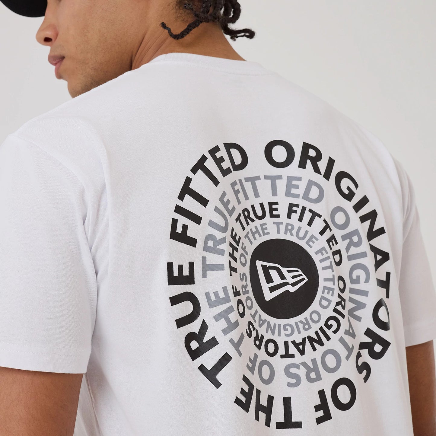 The model is wearing this New Era Circle T-Shirt in white. 4