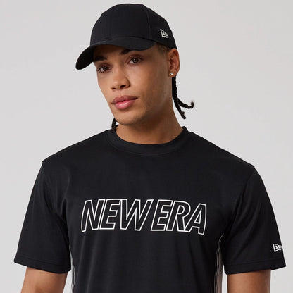 The model is wearing this New Era Mesh T-Shirt in black. 6