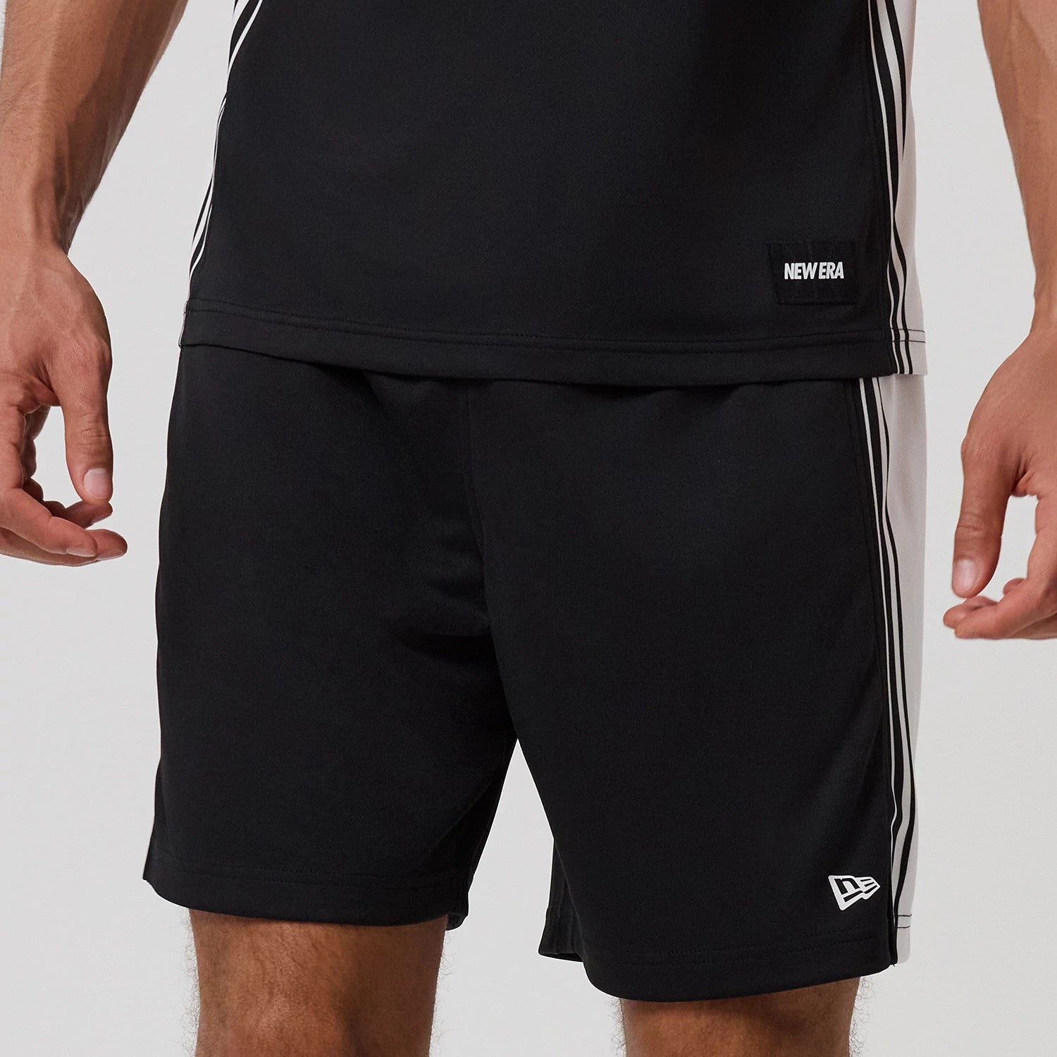 The model is wearing this New Era Mesh Shorts in black. 3
