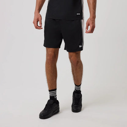 The model is wearing this New Era Mesh Shorts in black. 1