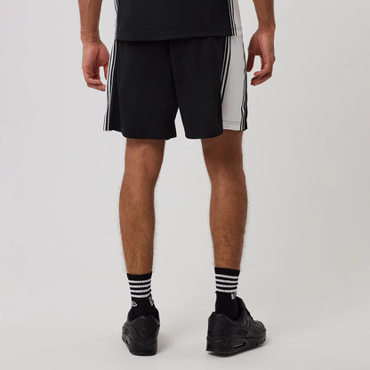 The model is wearing this New Era Mesh Shorts in black. 2