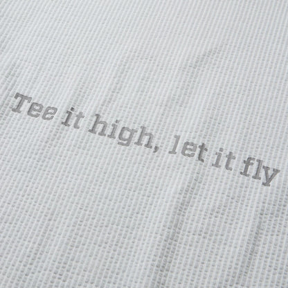 The model is wearing this New Era Seersucker Polo T-Shirt in grey. 8