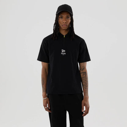 The model is wearing this New Era Seersucker Polo T-Shirt in black. 1