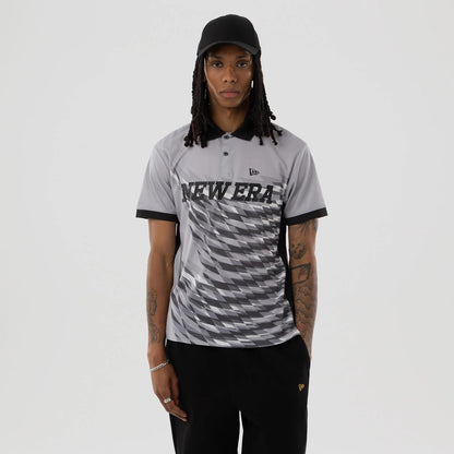 The model is wearing this New Era Grid Polo T-Shirt in grey. 1