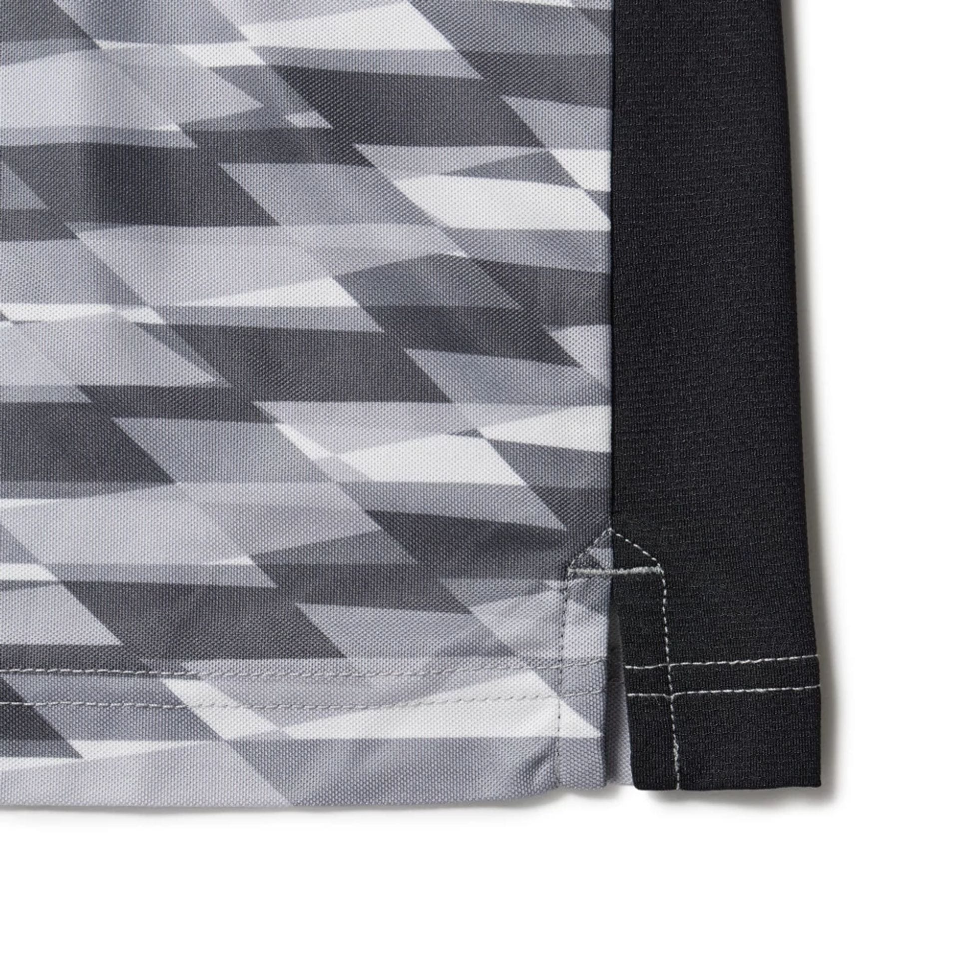 The model is wearing this New Era Grid Polo T-Shirt in grey. 8