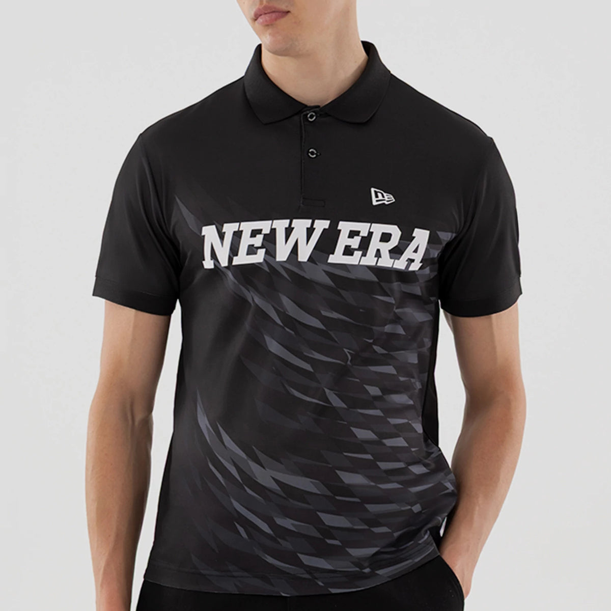 New Era Grid Black Polo T-Shirt, front view showing the black short-sleeved polo with a grid pattern across the chest, large white NEW ERA text, and a small raised New Era logo on the upper left side.