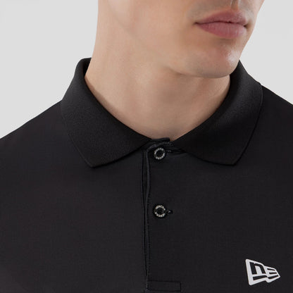 New Era Grid Black Polo T-Shirt, front view showing a close-up of the black polo collar with three black buttons, a raised New Era logo embroidered in white on the left chest area.