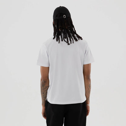 The model is wearing this New Era Kanoko Polo T-Shirt in white. 2