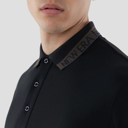 The model is wearing this New Era Kanoko Polo T-Shirt in black. 5