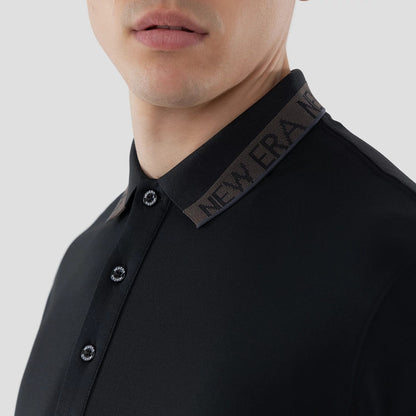 The model is wearing this New Era Kanoko Polo T-Shirt in black. 5