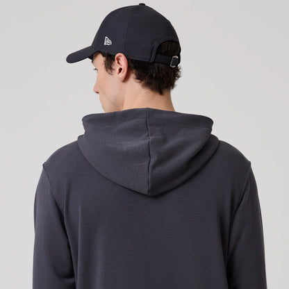The model is wearing this New Era New York Oversized Pullover Hoodie in dark grey. 7