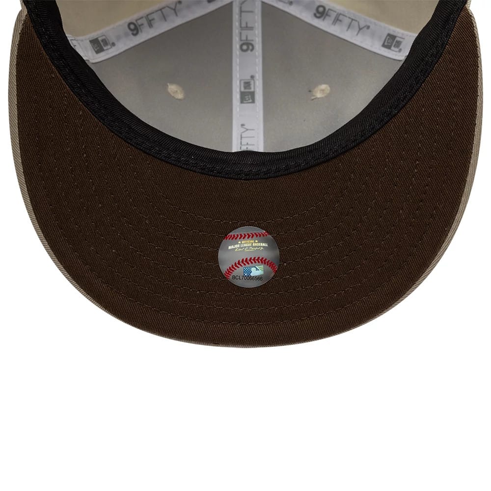 Pictured is this Hajime Sorayama X MLB San Diego Padres Retro Crown 9FIFTY cap in Cream. 2