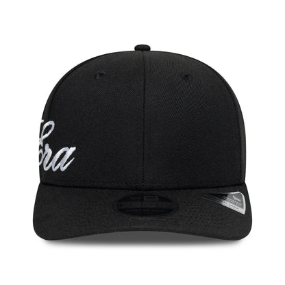 New Era Big Script Black 9SEVENTY Stretch Snap Adjustable Cap, front view showing white script logo embroidered on the front panel and a 9SEVENTY size sticker on the black visor below the black top button.
