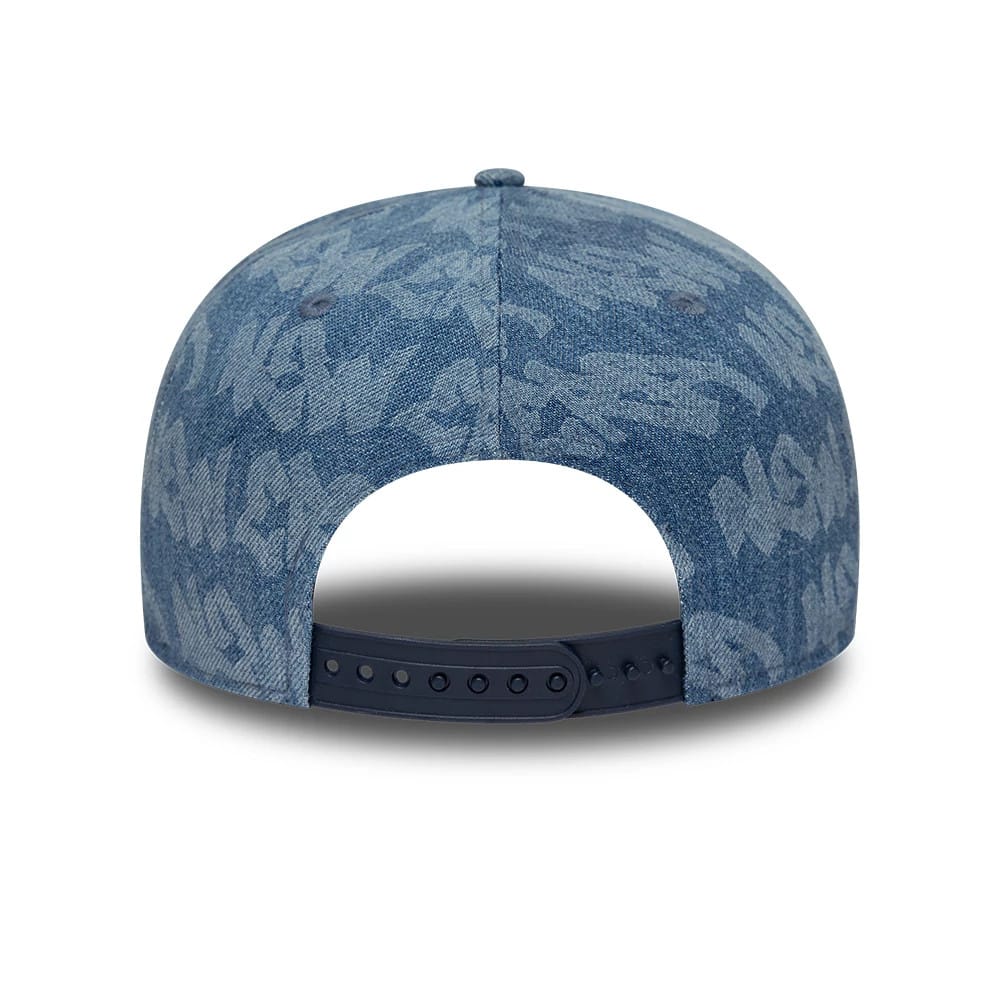 Pictured is this New Era Laser Burnout Washed Denim 9FIFTY Snapback Adjustable cap in navy. 7
