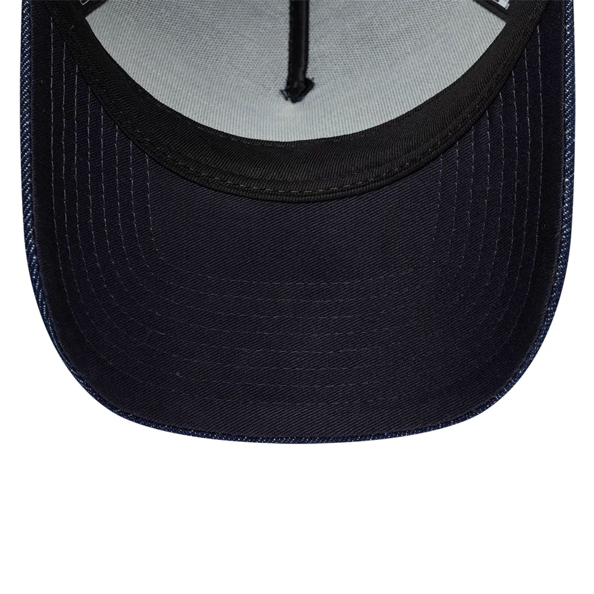 Pictured is this New Era Denim 9FORTY A-Frame Trucker cap in navy. 7