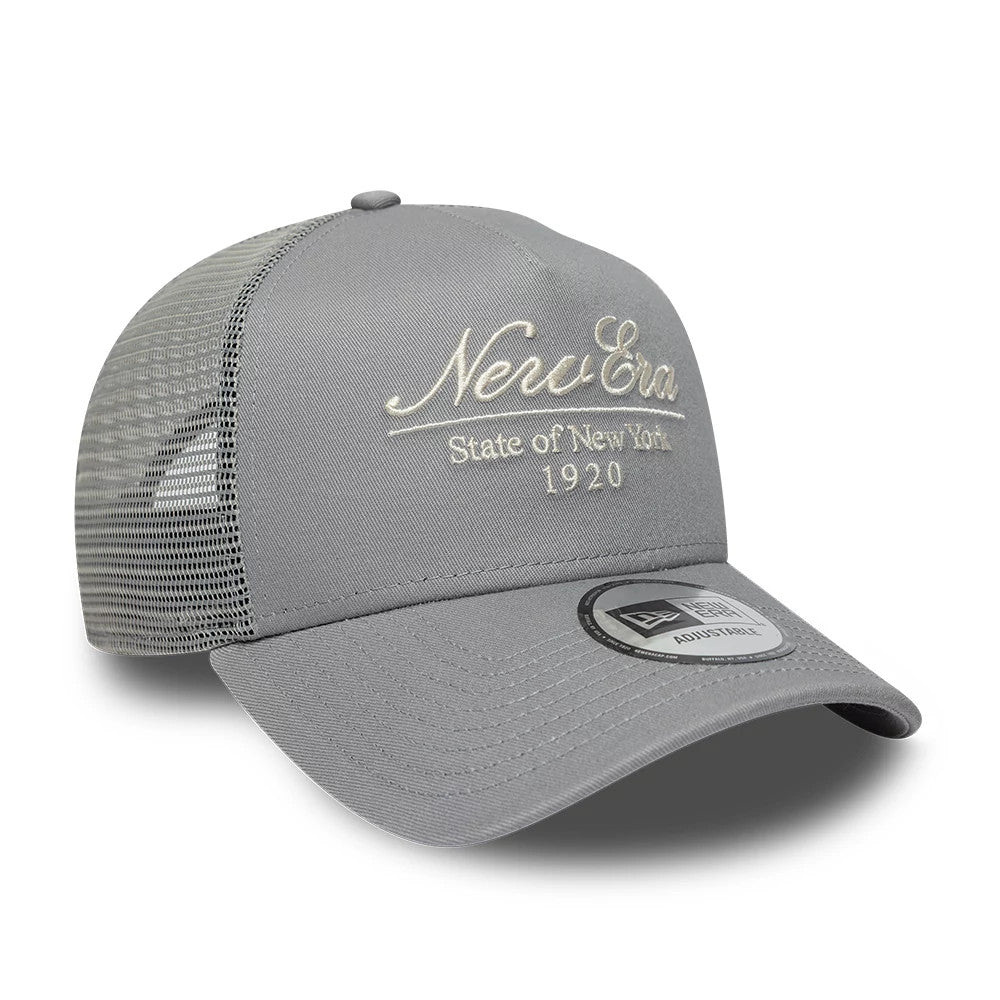Pictured is this New Era Script 9FORTY A-Frame Trucker cap in grey. 3