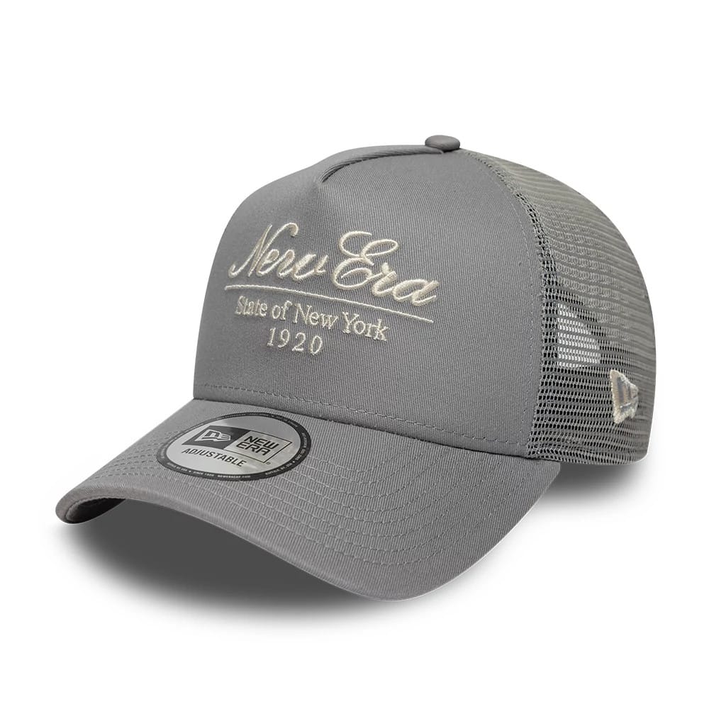 Pictured is this New Era Script 9FORTY A-Frame Trucker cap in grey. 1