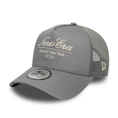 Pictured is this New Era Script 9FORTY A-Frame Trucker cap in grey. 1