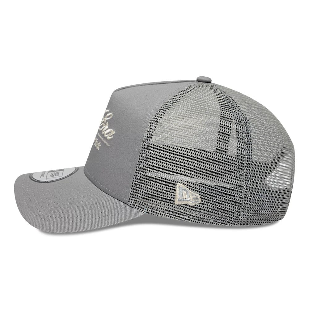 Pictured is this New Era Script 9FORTY A-Frame Trucker cap in grey. 4