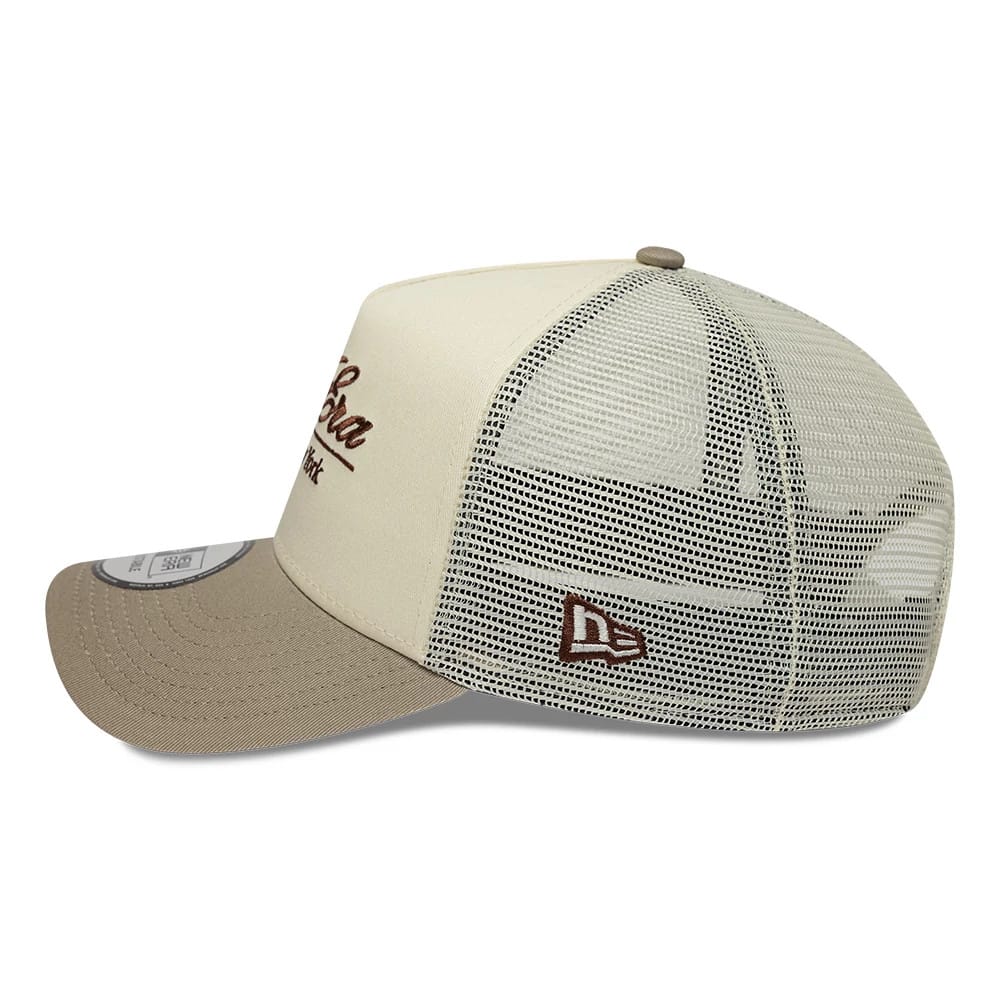 Pictured is this New Era Script 9FORTY A-Frame Trucker cap in cream. 4