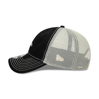 New Era Tagging Logo Black New Era 9TWENTY Trucker Adjustable Cap, side view showing the embroidered New Era flag logo on the left mesh panel, with a curved black visor and distinct white stitching along the crown and visor edge.