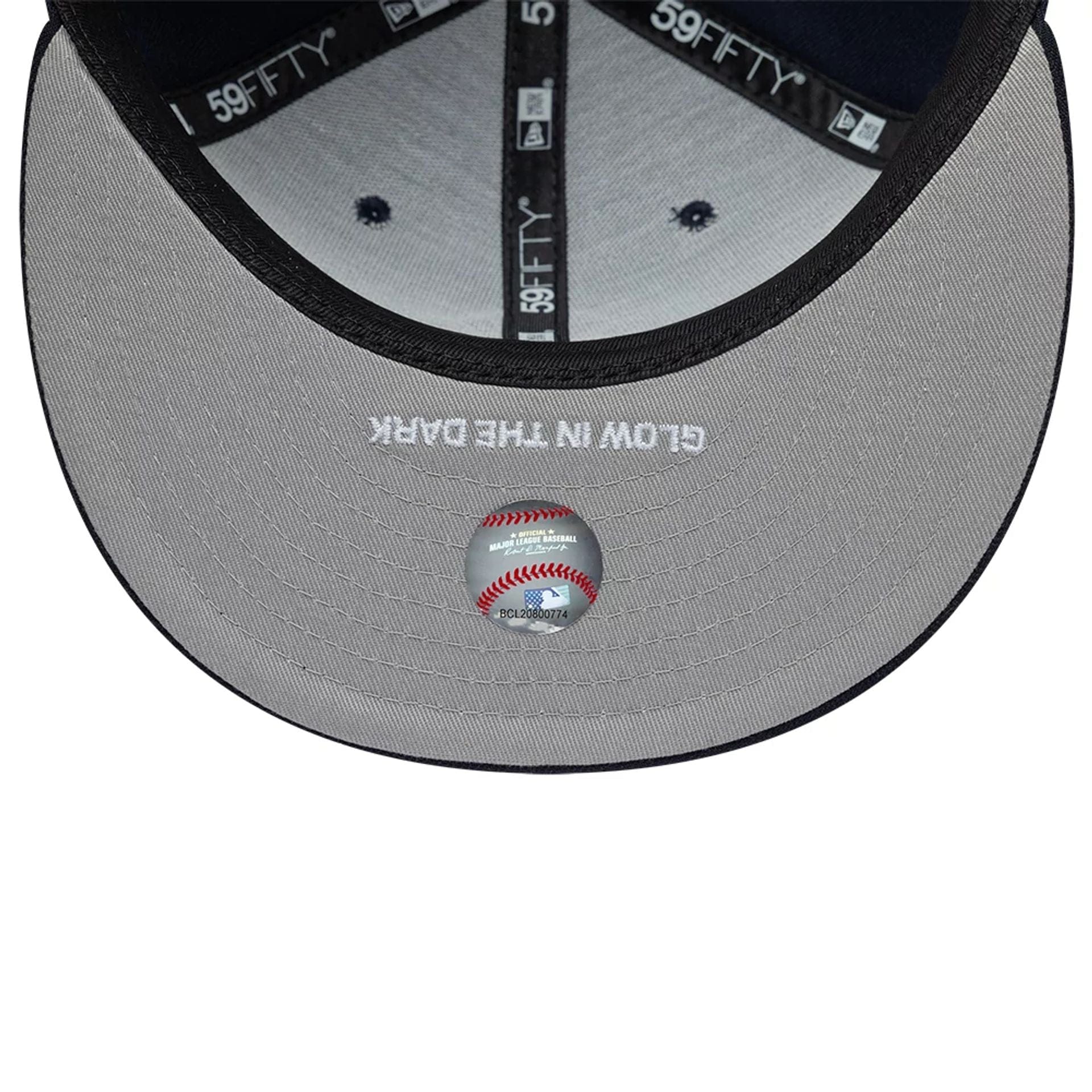 Pictured is this MLB Glow In The Dark New York Yankees 59FIFTY Fitted cap in navy. 2