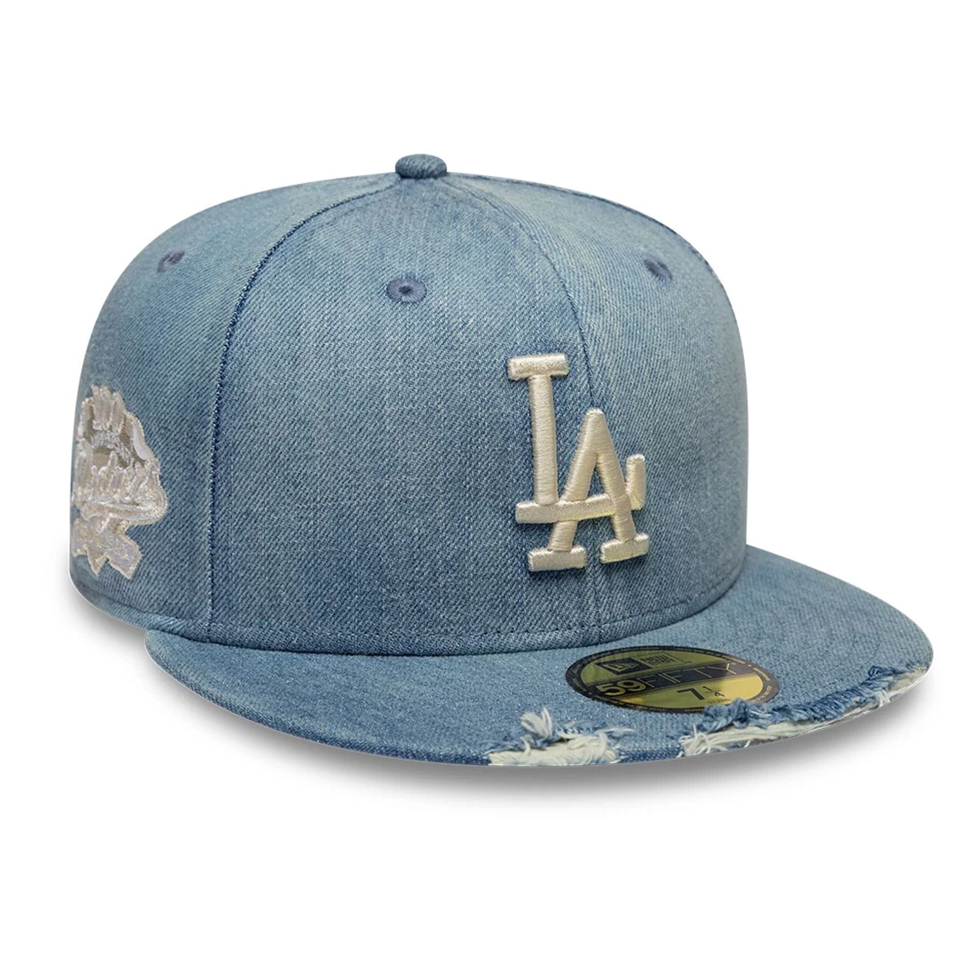 Pictured is this MLB Distressed LA Dodgers 59FIFTY Fitted cap in navy. 1