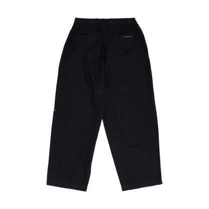 The model is wearing this New Era Balloon Leg Trousers in black. 2